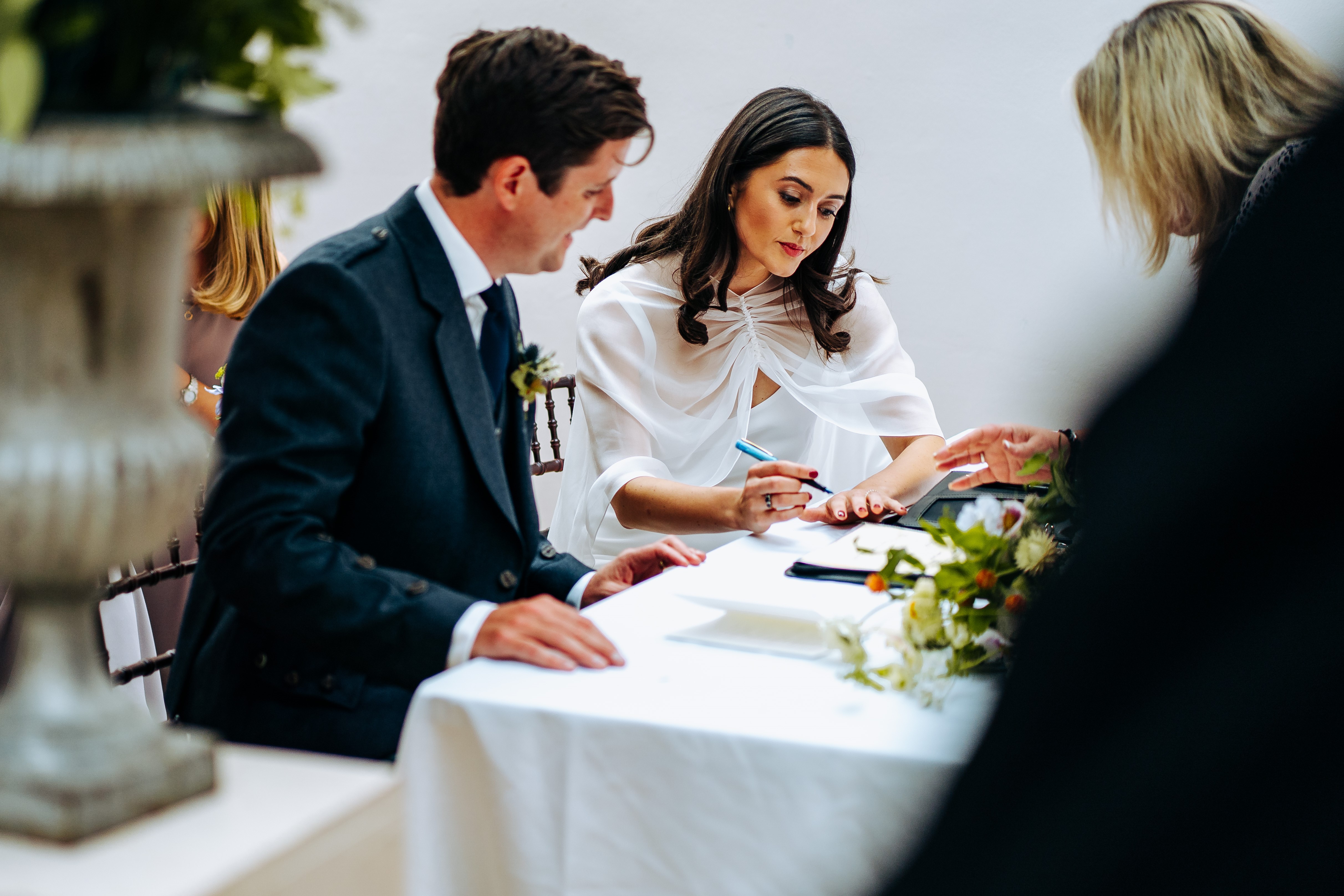 Couple signing their wedding papers at Dulwich Picture Gallery