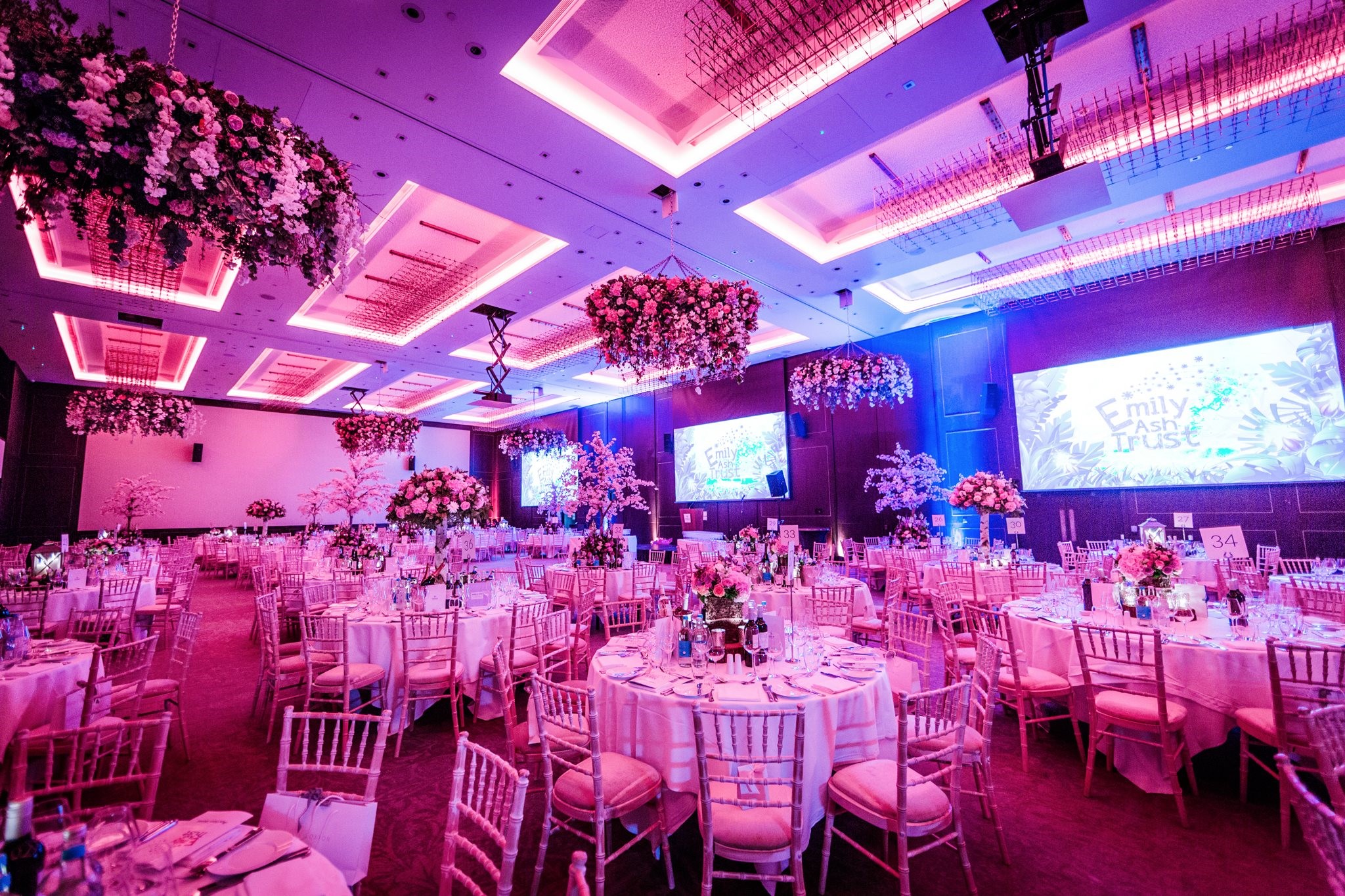 A gala dinner with hanging flowers in the Hilton ballroom