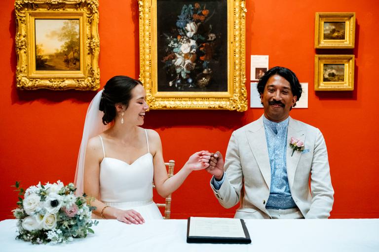 Couple signing marriage certificate